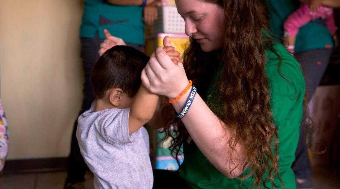 A Projects Abroad intern gains social work experience assessing children at a daycare centre. An intern assesses a young child at a daycare centre during one of our Social Work internships.
